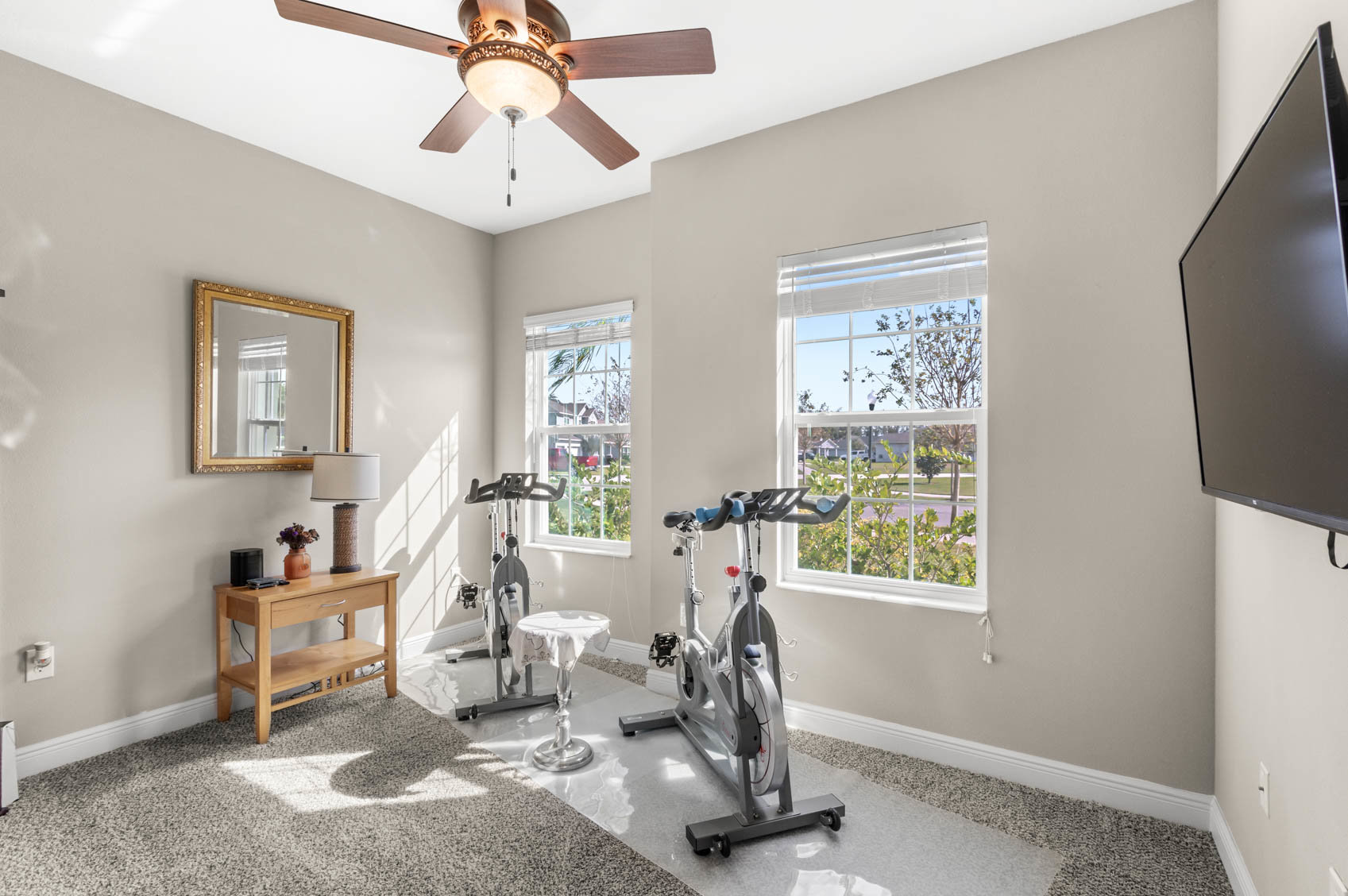 bedroom with workout machines
